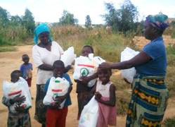 Distributing meal supplements in Lusaka, Zambia